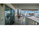 White patio with white railings, table, and flowers under a white roof and blue sky at 786 Cinnabar Dr, Apache Junction, AZ 85119