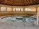Enjoy the community spa with an internal fountain covered from sun in octagonal shade structure at 786 Cinnabar Dr, Apache Junction, AZ 85119