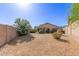 Backyard features desert landscaping, trees and a block fence at 10431 E Morning Star Dr, Scottsdale, AZ 85255
