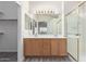 Bathroom features a dual sink vanity with a large mirror and a glass enclosed shower at 10431 E Morning Star Dr, Scottsdale, AZ 85255
