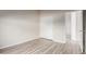 This bedroom has neutral walls, light colored wood floors and a double door closet at 10431 E Morning Star Dr, Scottsdale, AZ 85255