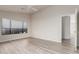 Bright bedroom with neutral paint, window, and vinyl flooring at 10431 E Morning Star Dr, Scottsdale, AZ 85255