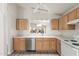 Modern kitchen features stainless steel dishwasher, white countertops, and view of the breakfast nook at 10431 E Morning Star Dr, Scottsdale, AZ 85255