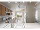A view of the kitchen from the dining area showing ample countertop space and white appliances at 10431 E Morning Star Dr, Scottsdale, AZ 85255