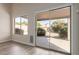 Living room showcasing a sliding glass door access to the backyard and lots of natural light at 10431 E Morning Star Dr, Scottsdale, AZ 85255