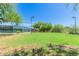 Expansive community lawn adjacent to the tennis courts, offering a serene recreational space at 10431 E Morning Star Dr, Scottsdale, AZ 85255