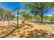 Fun-filled community playground with swings and play structures, surrounded by lush trees at 10431 E Morning Star Dr, Scottsdale, AZ 85255