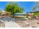Community playground, tennis court, ramada and picnic tables at 10431 E Morning Star Dr, Scottsdale, AZ 85255