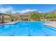 Community pool with lounge chairs and mountain views at 10431 E Morning Star Dr, Scottsdale, AZ 85255