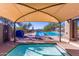 Relaxing poolside lounge area with ample seating and shade, ideal for enjoying sunny days at 10431 E Morning Star Dr, Scottsdale, AZ 85255