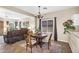 Inviting dining room with seating for four and view into the living room at 1081 W Stephanie Ln, San Tan Valley, AZ 85143