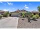 Charming single-story home featuring a two-car garage and desert landscaping at 1081 W Stephanie Ln, San Tan Valley, AZ 85143