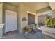 Inviting front porch with seating area, rug, and decorative accents at 1081 W Stephanie Ln, San Tan Valley, AZ 85143