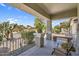 Inviting front porch with decorative statue, seating, and an American flag at 1081 W Stephanie Ln, San Tan Valley, AZ 85143