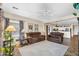 Comfortable living room featuring plush seating, natural light, and open floor plan at 1081 W Stephanie Ln, San Tan Valley, AZ 85143