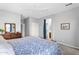 Comfortable main bedroom with ceiling fan and access to ensuite bathroom at 1081 W Stephanie Ln, San Tan Valley, AZ 85143