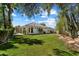 Expansive backyard with lush lawn and mature trees at 11143 E Onyx Ct, Scottsdale, AZ 85259