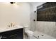Sleek bathroom featuring a marble shower and stylish black vanity at 11143 E Onyx Ct, Scottsdale, AZ 85259