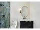 Modern bathroom with vanity, toilet, and glass-enclosed shower at 11143 E Onyx Ct, Scottsdale, AZ 85259