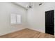 Clean bedroom with natural light from the window and plank flooring at 11143 E Onyx Ct, Scottsdale, AZ 85259