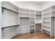 Spacious walk-in closet with custom shelving and hanging rods at 11143 E Onyx Ct, Scottsdale, AZ 85259