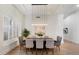 Contemporary dining room featuring stylish lighting, modern decor and plantation shutters at 11143 E Onyx Ct, Scottsdale, AZ 85259