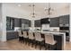 Sleek kitchen with stainless appliances, center island, and plenty of bar seating at 11143 E Onyx Ct, Scottsdale, AZ 85259