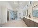 Bright and luxurious main bathroom features a walk-in shower with marble surround, dual sinks and a soaking tub at 11143 E Onyx Ct, Scottsdale, AZ 85259
