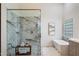 Bright and modern main bathroom featuring walk-in shower with a marble surround and a soaking tub at 11143 E Onyx Ct, Scottsdale, AZ 85259