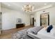 Bright main bedroom boasts hardwood floors, a cozy seating area, and an ensuite bath at 11143 E Onyx Ct, Scottsdale, AZ 85259