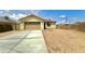 Charming single-story home featuring a neutral color, two-car garage, and a well-kept driveway at 11216 W Apache St, Avondale, AZ 85323