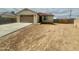 Charming single-story home featuring a neutral color, two-car garage, and a well-kept driveway at 11216 W Apache St, Avondale, AZ 85323