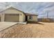 A well-maintained single-story home has a neutral color palette, and a two-car garage at 11216 W Apache St, Avondale, AZ 85323