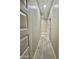 Hallway with hard surface flooring and doors at 11216 W Apache St, Avondale, AZ 85323