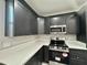 This renovated kitchen boasts modern appliances, and white countertops perfect for cooking at 11216 W Apache St, Avondale, AZ 85323