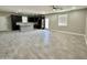 Spacious living area with the kitchen is perfect for modern living and hosting gatherings, with tile flooring at 11216 W Apache St, Avondale, AZ 85323
