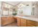 Bathroom featuring a vanity with double sinks and a large mirror at 1245 E Emile Zola Ave, Phoenix, AZ 85022