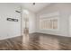 Empty bedroom with wood floors, ceiling fan and ensuite bathroom at 1245 E Emile Zola Ave, Phoenix, AZ 85022