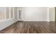 Empty bedroom with wood floors and a glass door leading to the outdoors at 1245 E Emile Zola Ave, Phoenix, AZ 85022