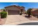 Cozy single-Gathering home showcasing desert landscaping, a spacious driveway, and a two-car garage at 1245 E Emile Zola Ave, Phoenix, AZ 85022