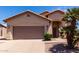 Charming single-Gathering home showcasing a well-maintained front yard and an attached two-car garage at 1245 E Emile Zola Ave, Phoenix, AZ 85022