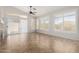 Inviting living room features sliding glass doors, plantation shutters, and a cozy ceiling fan at 1245 E Emile Zola Ave, Phoenix, AZ 85022