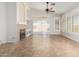 Open living room featuring a stylish fireplace, built-in shelving, and sliding glass door at 1245 E Emile Zola Ave, Phoenix, AZ 85022