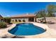 Beautiful backyard featuring a pristine pool, lush greenery, and a well-maintained home exterior at 1245 E Emile Zola Ave, Phoenix, AZ 85022
