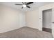 This bedroom features a closet and a ceiling fan at 12838 W Desert Mirage Dr, Peoria, AZ 85383