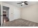 This bedroom features a closet and a ceiling fan at 12838 W Desert Mirage Dr, Peoria, AZ 85383