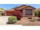 Inviting front yard featuring vibrant landscaping and a charming desert-scape design at 12838 W Desert Mirage Dr, Peoria, AZ 85383