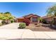 Charming single-story home with a well-manicured front yard and a two-car garage at 12838 W Desert Mirage Dr, Peoria, AZ 85383