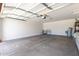 This garage features open space and built-in shelving at 12838 W Desert Mirage Dr, Peoria, AZ 85383