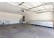 This garage features storage and built-in shelving at 12838 W Desert Mirage Dr, Peoria, AZ 85383